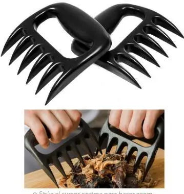 Black meat shredder claws being used to shred chicken